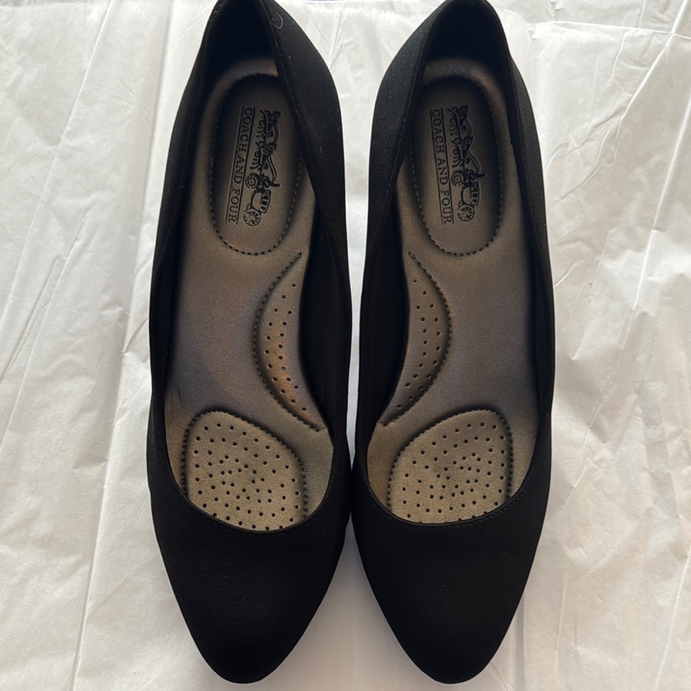 Black Coach and Four Heels